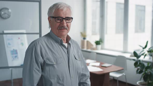 Senior Man Crossing Arms Portrait