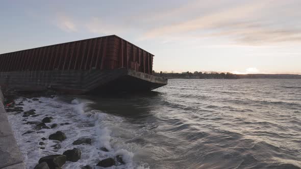 Barge Container Ship Collided on a Rocky Coast During Wind Storm