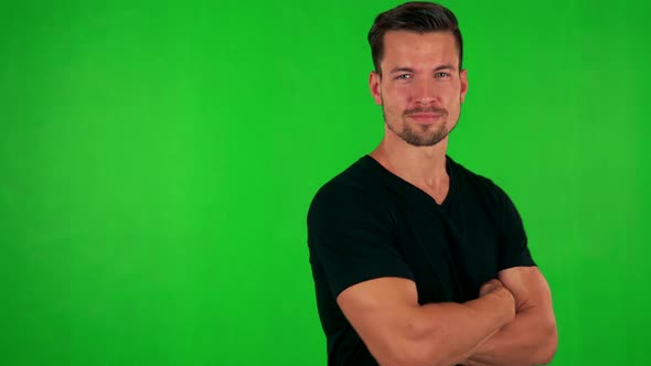 Young Handsome Caucasian Man Does Poses To Camera - Green Screen - Studio