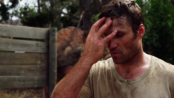 Tired military soldier standing at boot camp 4k