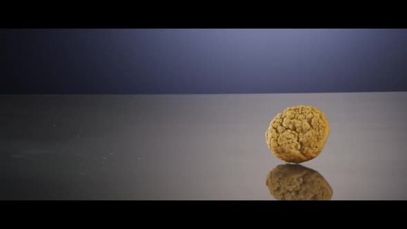 Falling cookies from above onto a reflective surface - COOKIES 220