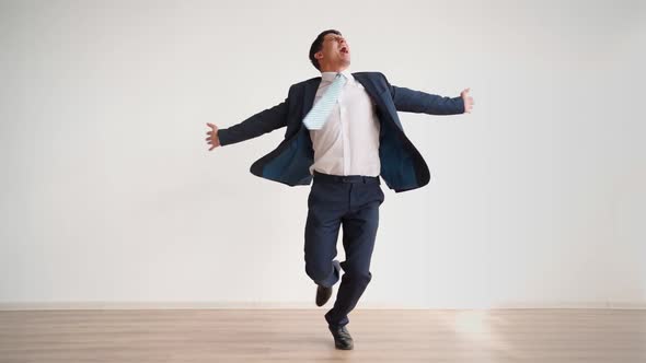 Funny Business Man Dancing for Joy and Success on a White Background