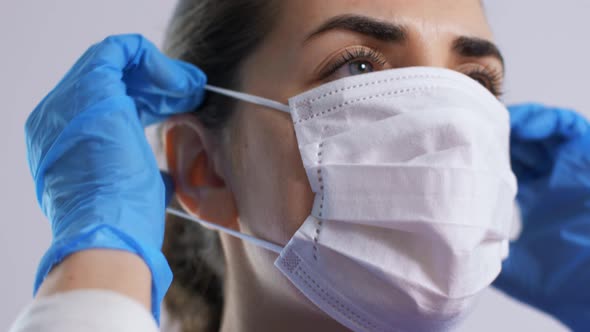 Female Doctor or Nurse Wearing Medical Face Mask