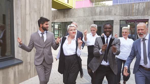 Slow Motion of Happy Business Dancers Have a Mad Mood After Successful Deal