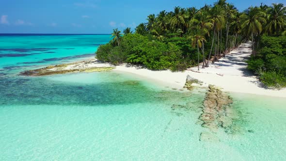 Aerial flying over travel of beautiful resort beach holiday by blue lagoon with white sand backgroun