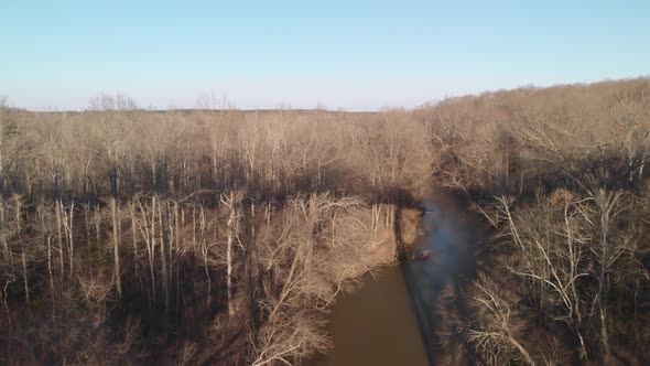 Flying backwards over the muddy Appomattox River to reveal High Bridge Trail, a reconstructed Civil