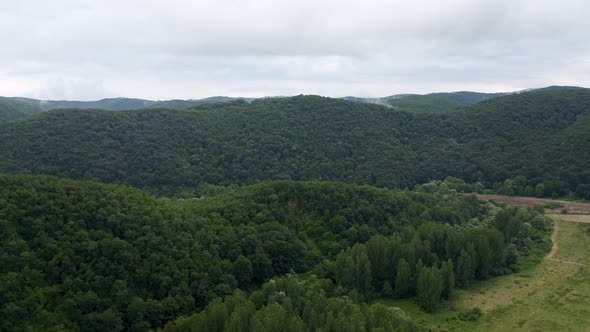 Drone flight over green mountain slopes