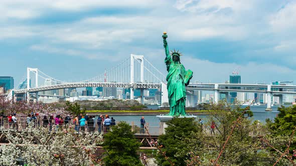 time lapse of unidentified tourist visited the Statue of Liberty and Rainbow bridge at Odaiba