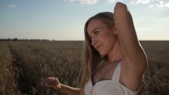 Adorable Girl Playing with Hair in Cereal Field