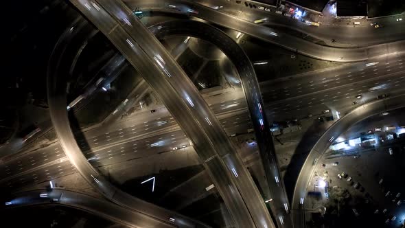 Traffic on Freeway Interchange. Aerial Night View Timelapse City Traffic