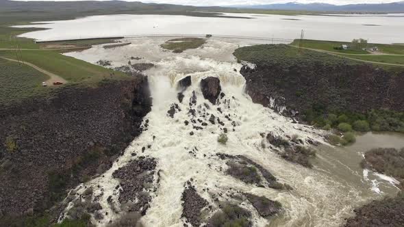 Aerial view of huge overflow waterfall at Magic Reservoir