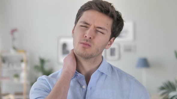 Handsome Young Man Trying to Relax Neck Pain