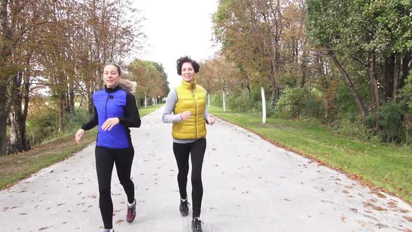 Two Woman Talking and Jogging