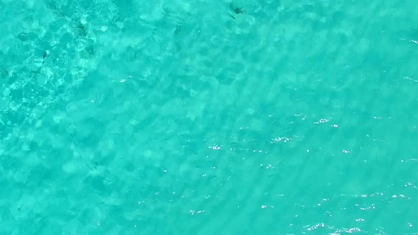 Aerial drone landscape of resort beach break by clear ocean with sand background