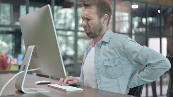 Back Pain, Uncomfortable Man Working on Computer at Work