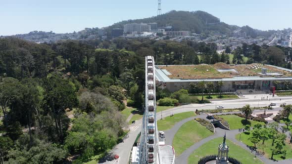 Aerial close-up profile shot of the SkyStar Ferris Wheel in Golden Gate Park, San Francisco. 4K