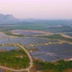 Aerial view of solar panels or solar cells on the roof in farm. Power plant with green field - VideoHive Item for Sale
