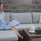 Beautiful Girl Sitting on the Sofa - VideoHive Item for Sale