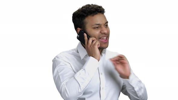 Young Expressive Businessman Talking on Phone