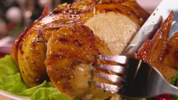 Super Closeup of Delicious Baked Christmas Chicken Cut with the Knife