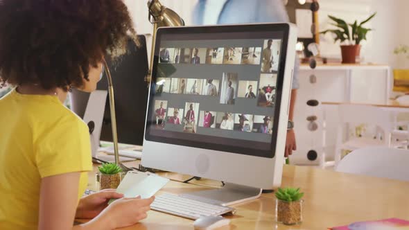 Side view of mixed race woman working in creative office