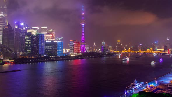 Shanghai River Urban Cityscape Aerial Skyline Panorama Timelapse at Night Zoom Out