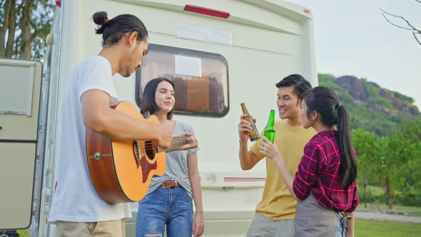 Group of Asian man and woman are having new year party outdoor in the evening together.