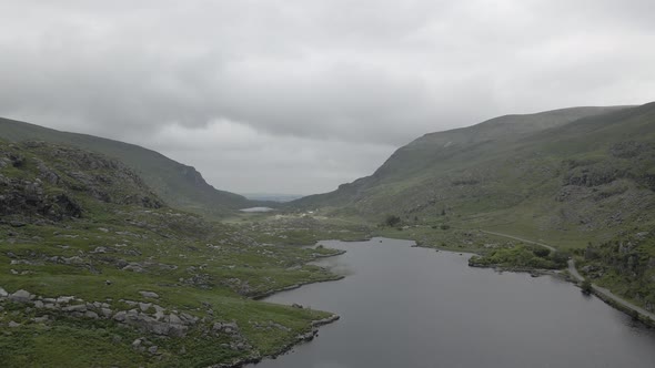 Overcast Sky Over Idyllic Lake In The Gap Of Dunloe Valley In County Kerry, Ireland. - Aerial Shot