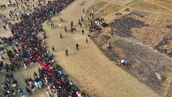 Aerial view of people watching horse race in Mohanpur, Bangladesh.