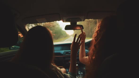 Two Happy Female Woman Friends Enjoy Travel in Car