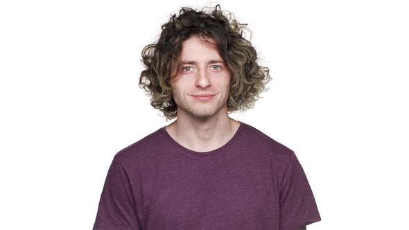 Portrait of Caucasian Curly Guy in Casual Tshirt Looking on Camera with Happy Smile Isolated Over