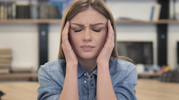 Portrait of Tense Woman with Headache