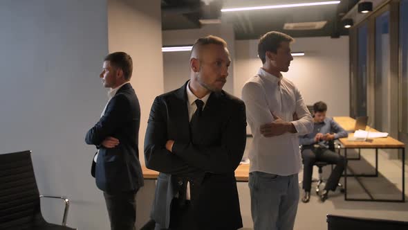 Cool Epic Camera Movement Shot of 3 Confident Attractive Handsome Business People.