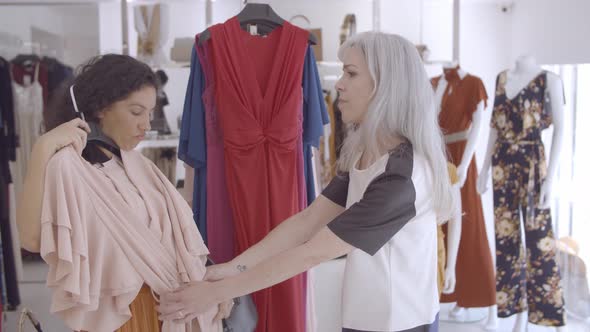 Happy Female Friends Enjoying Shopping Together