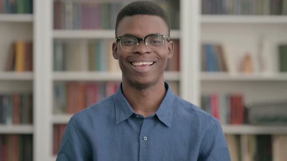 Young African Man Smiling at Camera