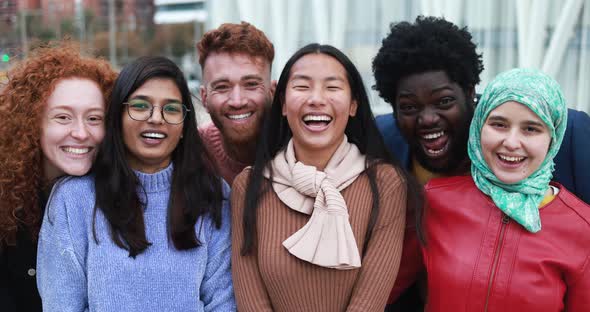 Group of young diverse people having fun outdoor laughing together - Diversity concept