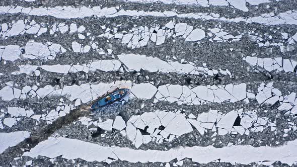 Icebreakers on Vistula river breaking the ice, Poland, Plock, 2020-02-18