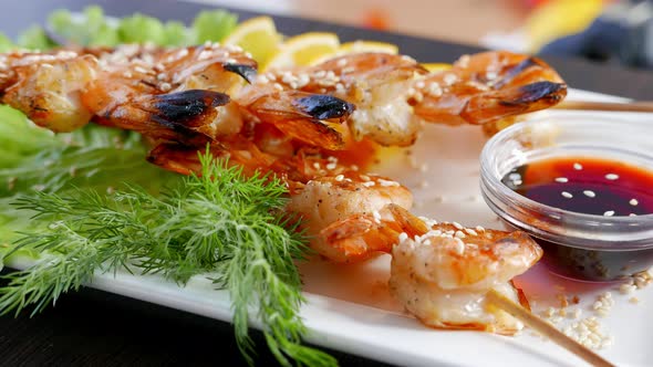 Shrimp Kebabs with Lemon and Sauce  Seafood on a White Plate