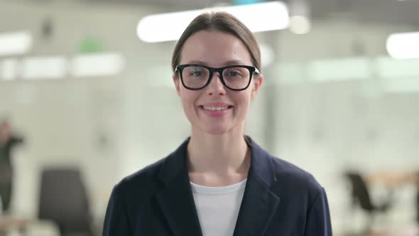 Portrait of Attractive Young Businesswoman Smiling at Camera 