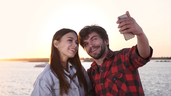 Couple in love taking selfies outdoors