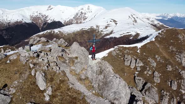 Flight around hikers on top of a mountain, European Alps, Como, Italy