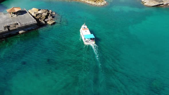 small ferry boat approaching its destination