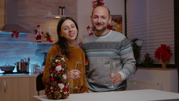 Festive Couple Talking on Video Call Conference