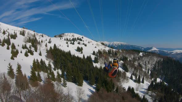 Flying Paragliding in Winter Mountains, Adrenaline Adventure of Freedom Free Flight