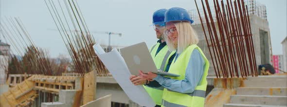 Engineers Checking Blueprints