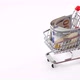 Hand pushing miniature toy supermarket trolley.  - VideoHive Item for Sale