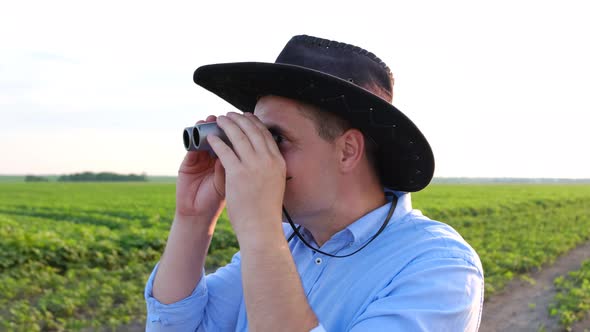 Surprised Man Looks Through Binoculars
