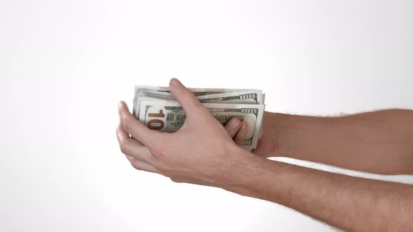 Male Hands That Count Hundred Dollar Bills on a White Background Isolate. Place To Insert Text or