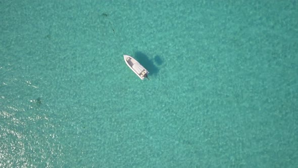 Aerial drone view of a fishing motor boat in the Bahamas, Caribbean. 