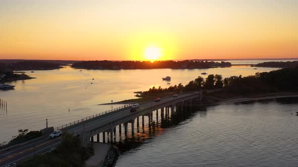 Stunning sunset over a bridge in Sag Harbor, Hamptons, New York, Aerial shot.